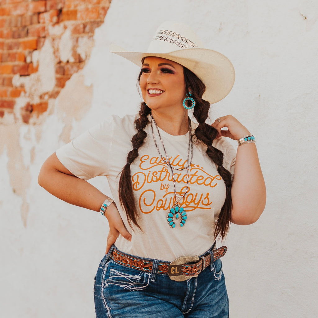 “Easily Distracted By Cowboys” Tee